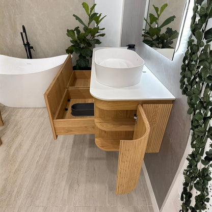 SANTORINI curved vanity with wavy vertical pattern and soft-close drawers