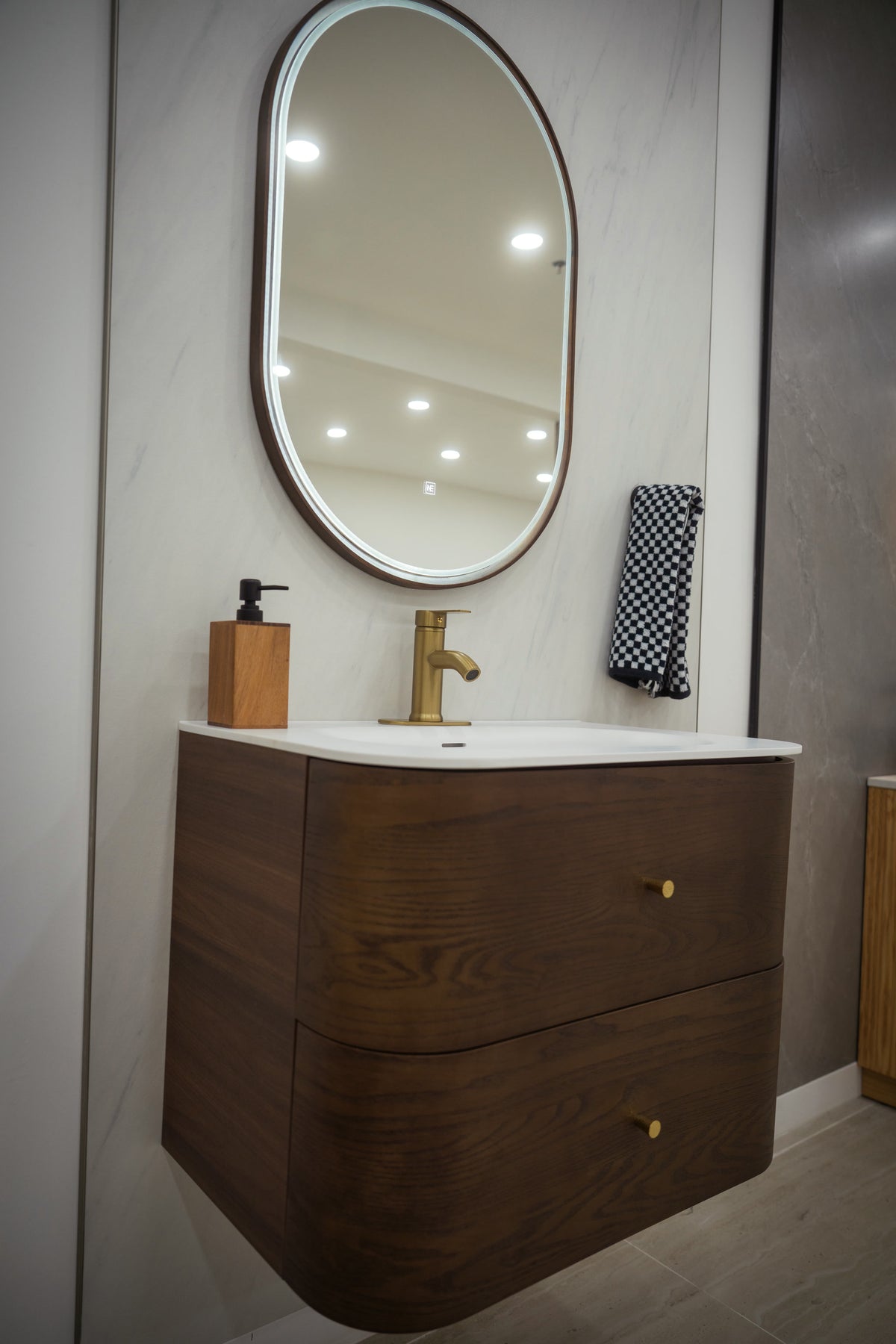 ASPEN curved walnut vanity and matte white sink detail