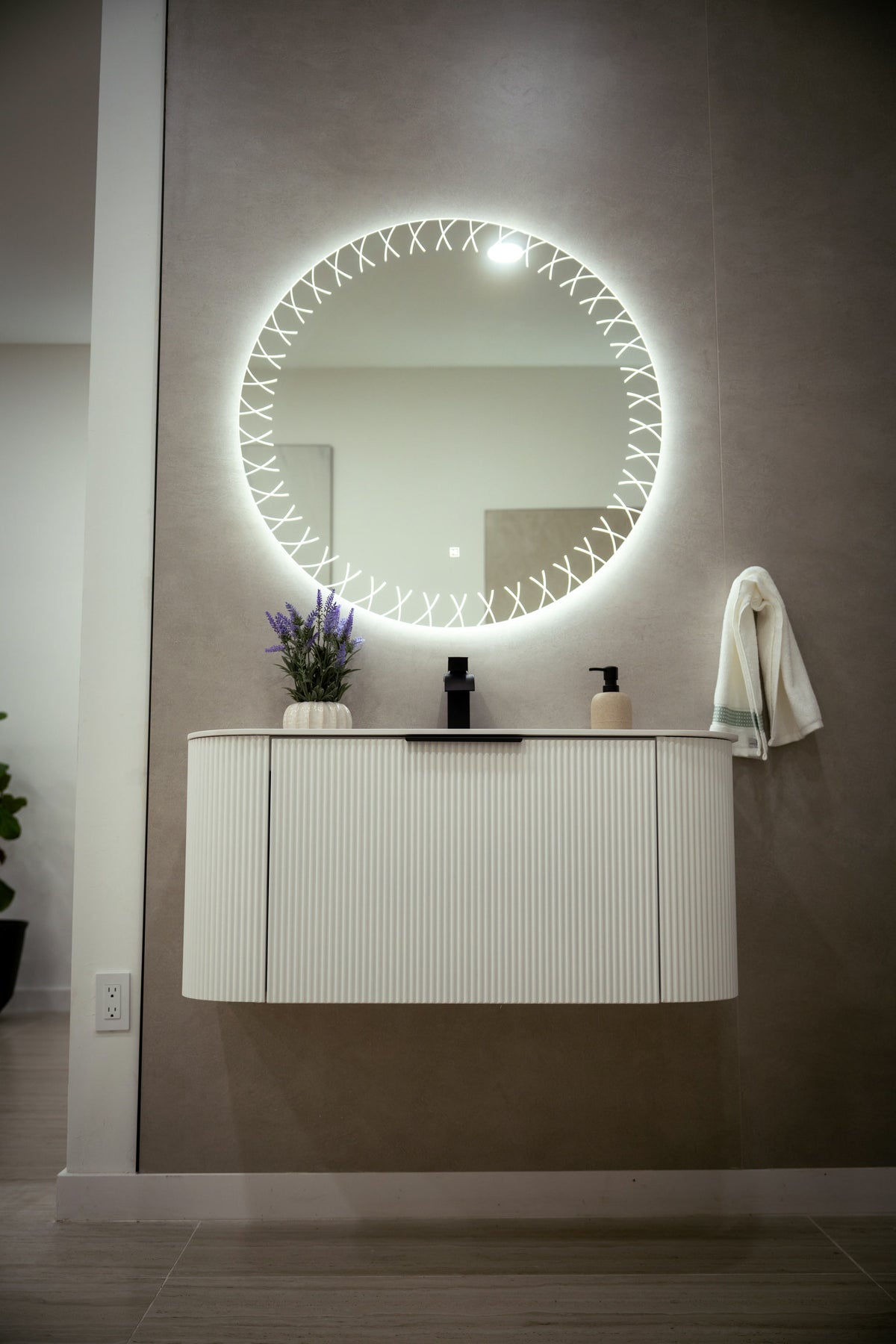 VEGAS white floating vanity with black aluminum handle in a modern bathroom