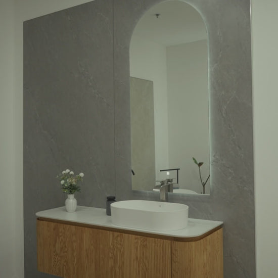 SANTORINI 59-inch natural oak floating bathroom vanity with curved silhouette, porcelain countertop, resin basin and Zenith LED mirror