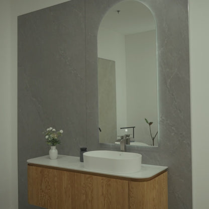 SANTORINI 59-inch natural oak floating bathroom vanity with curved silhouette, porcelain countertop, resin basin and Zenith LED mirror
