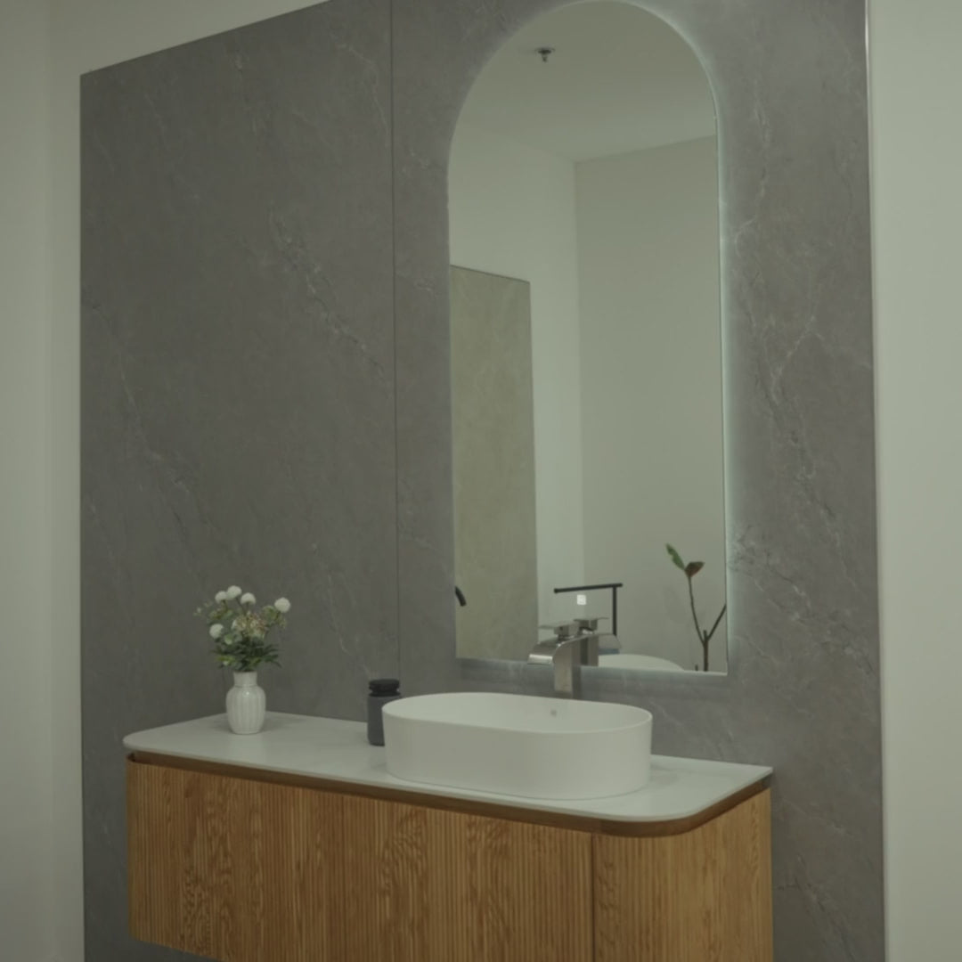 SANTORINI 59-inch natural oak floating bathroom vanity with curved silhouette, porcelain countertop, resin basin and Zenith LED mirror