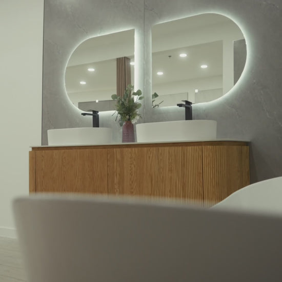 CAPRI 71-inch natural oak floating double bathroom vanity with curved wavy design, porcelain countertop, dual resin basins and Gemini LED mirror